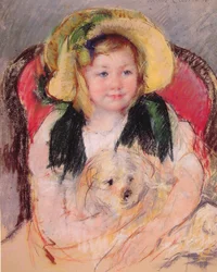 Sara avec son chien dans un fauteuil